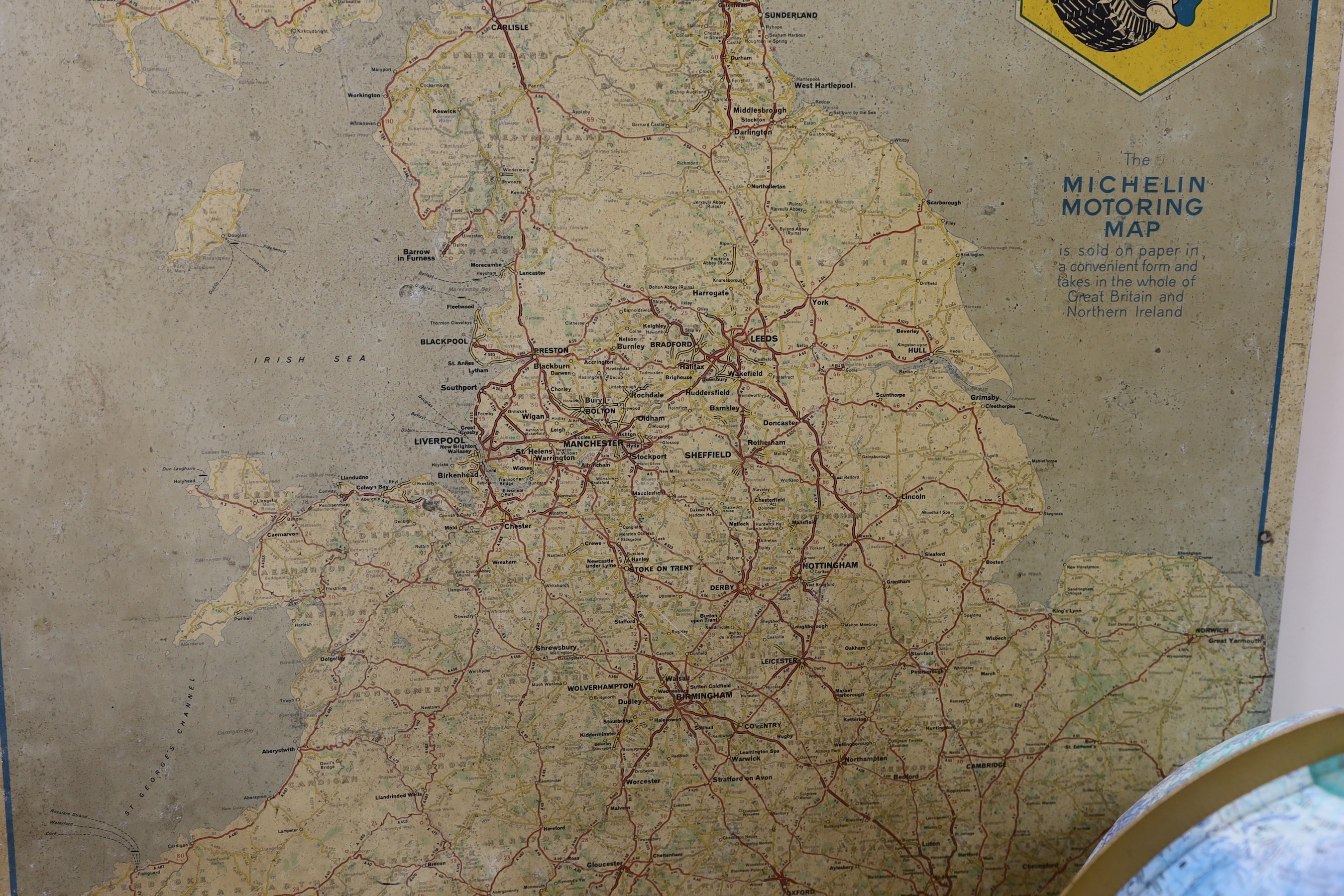 A BP oil can, Michelin motoring map and a revolving globe.